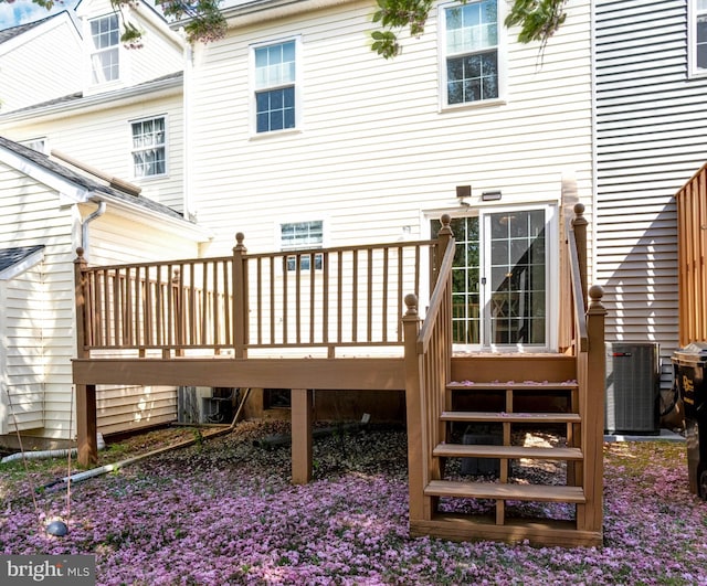 back of property featuring a wooden deck and central air condition unit
