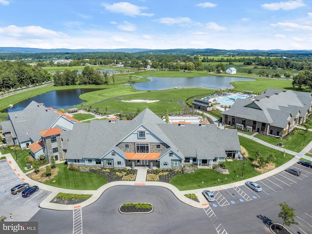 bird's eye view with a water view and golf course view