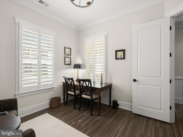 office with dark wood-type flooring, crown molding, plenty of natural light, and visible vents