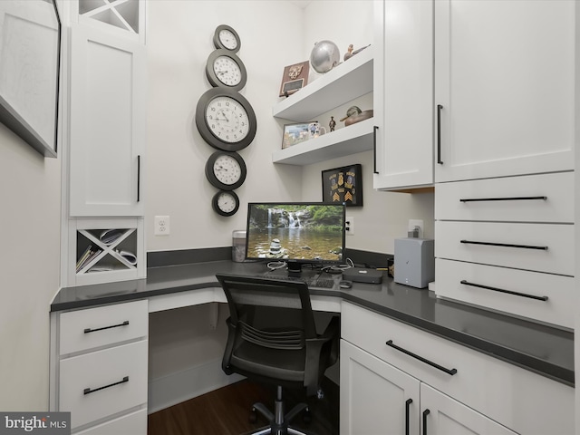 office with built in study area and wood finished floors