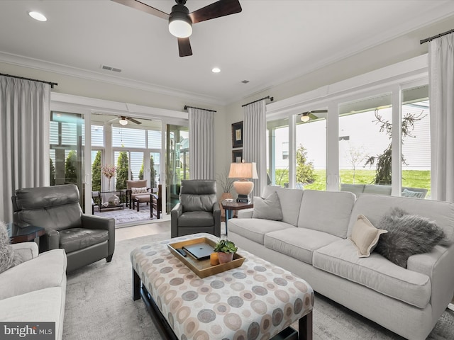 living room with visible vents, a ceiling fan, crown molding, and recessed lighting