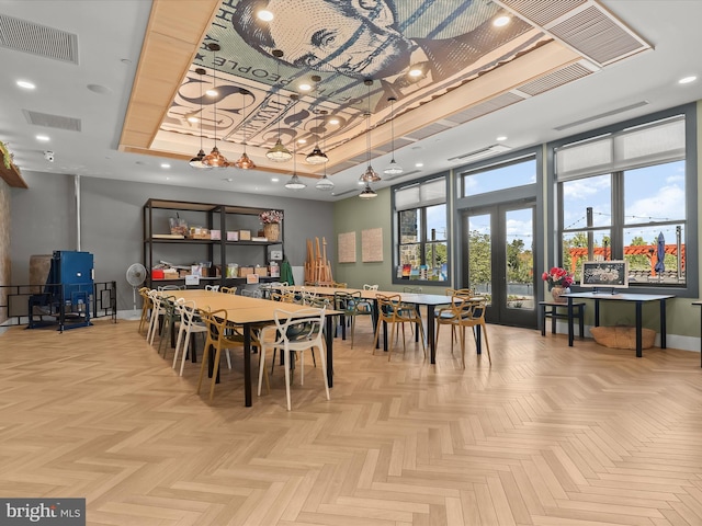 dining room with baseboards, visible vents, french doors, and a raised ceiling
