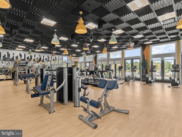 exercise room with wood finished floors