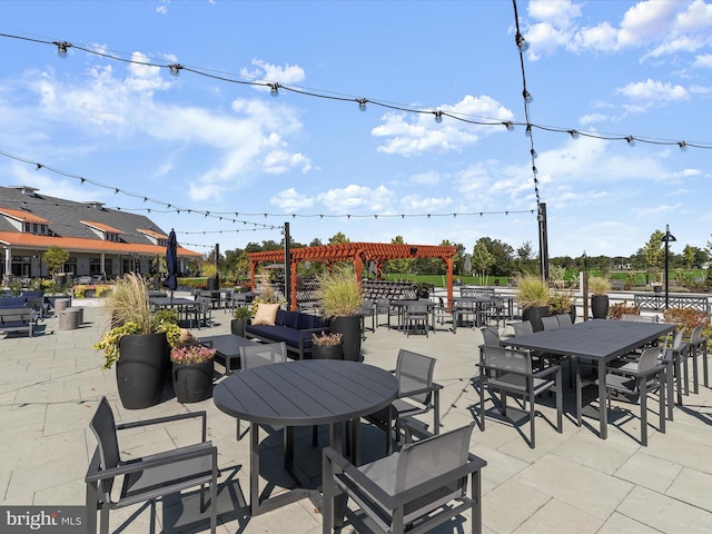 view of patio / terrace featuring a pergola and outdoor dining area