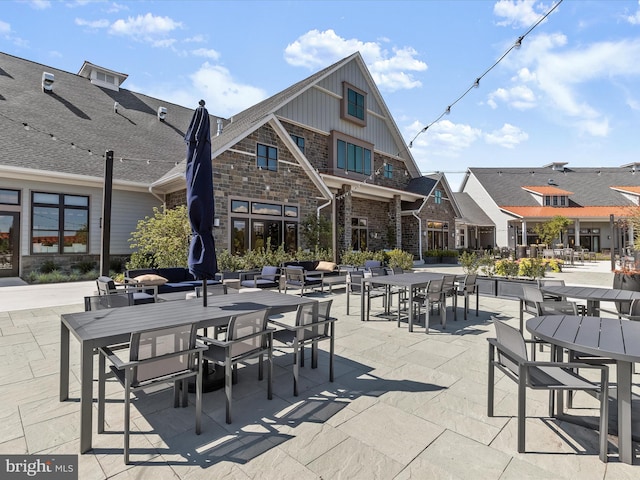 view of patio / terrace with a residential view and outdoor dining area