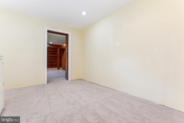 unfurnished room with recessed lighting and carpet