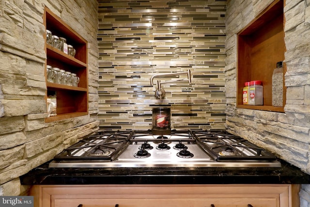 441 Millgate Rd, Bellefonte, PA 16823 - kitchen with stainless steel gas stovetop, dark countertops, and decorative backsplash