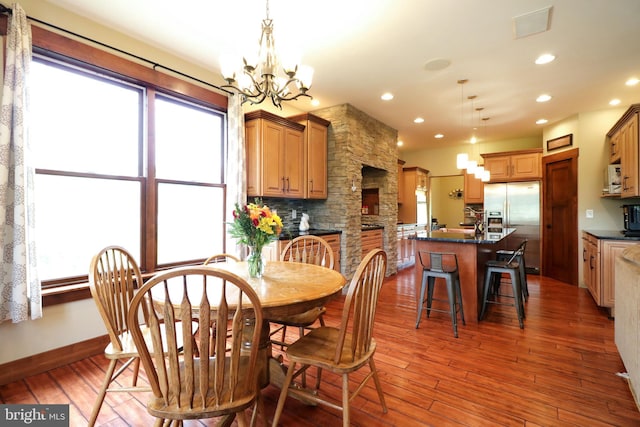 441 Millgate Rd, Bellefonte, PA 16823 - dining room with a chandelier, wood finished floors, recessed lighting, and baseboards