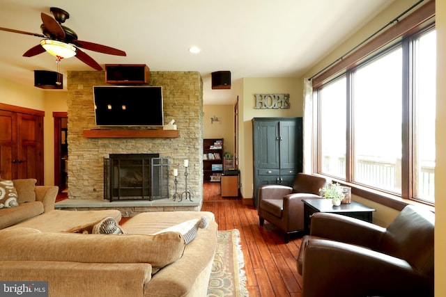 441 Millgate Rd, Bellefonte, PA 16823 - living room with a ceiling fan, a stone fireplace, and hardwood / wood-style flooring