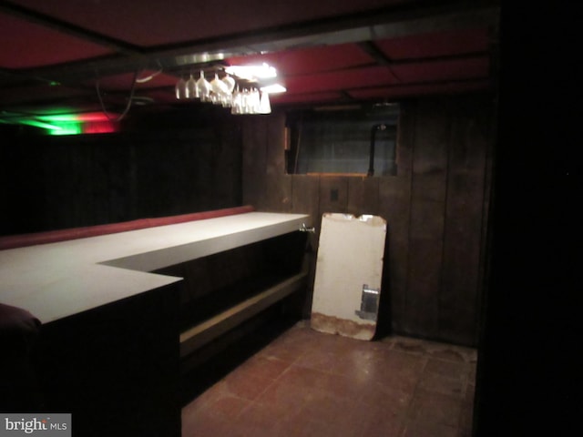 finished below grade area with tile patterned floors