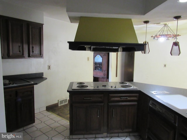 kitchen featuring exhaust hood, dark countertops, electric cooktop, a peninsula, and visible vents