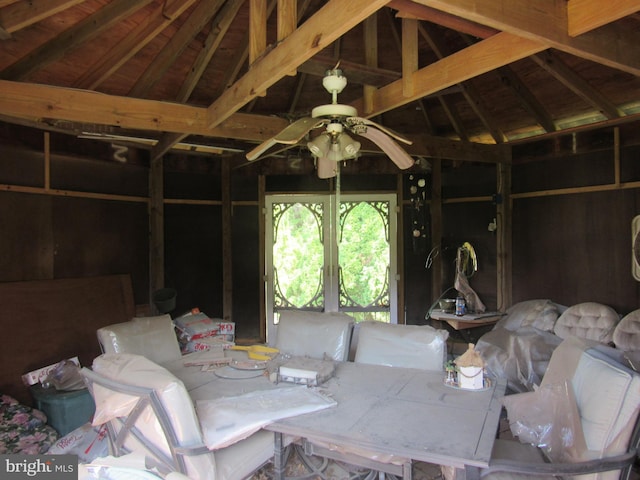 interior space featuring a ceiling fan and vaulted ceiling