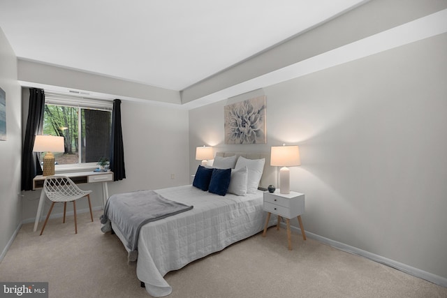 carpeted bedroom with baseboards