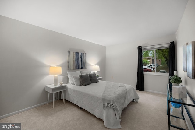 carpeted bedroom with baseboards
