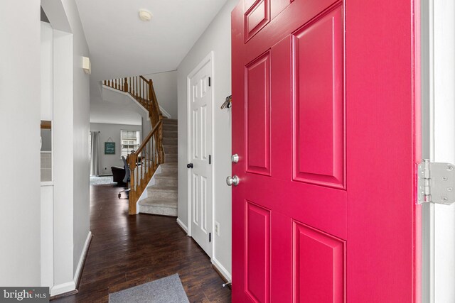 13215 Golders Green Pl, Bristow, VA 20136 - foyer entrance with dark wood-style flooring, stairway, and baseboards