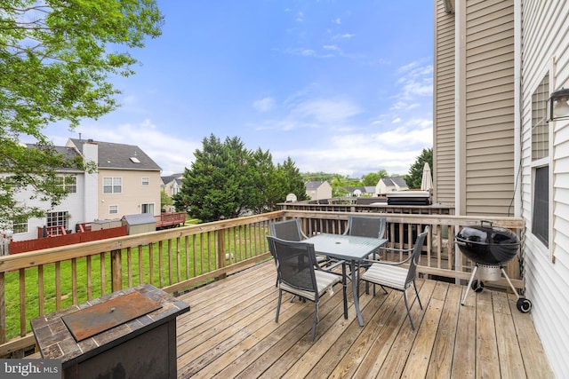 13215 Golders Green Pl, Bristow, VA 20136 - wooden terrace featuring outdoor dining space, a lawn, a residential view, and grilling area