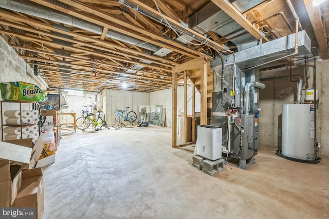 basement featuring gas water heater and heating unit