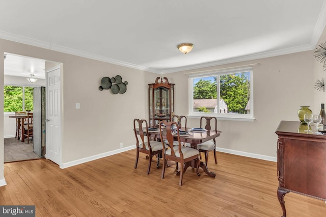 2300 Foster Pl, Temple Hills, MD 20748 - dining room featuring light wood-style flooring, baseboards, and crown molding