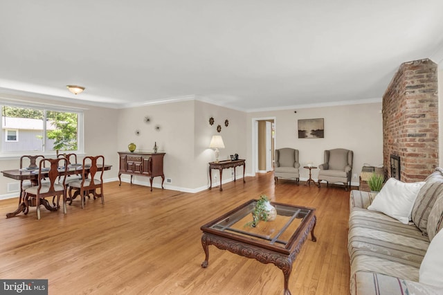 2300 Foster Pl, Temple Hills, MD 20748 - living area with light wood-style flooring, crown molding, baseboards, and a brick fireplace