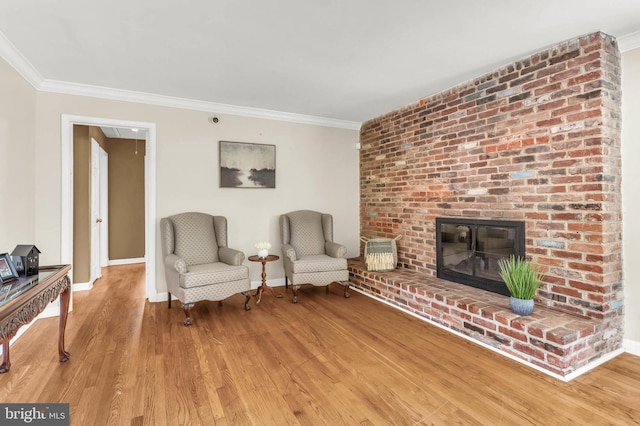 2300 Foster Pl, Temple Hills, MD 20748 - living area with light wood finished floors, crown molding, baseboards, and a fireplace