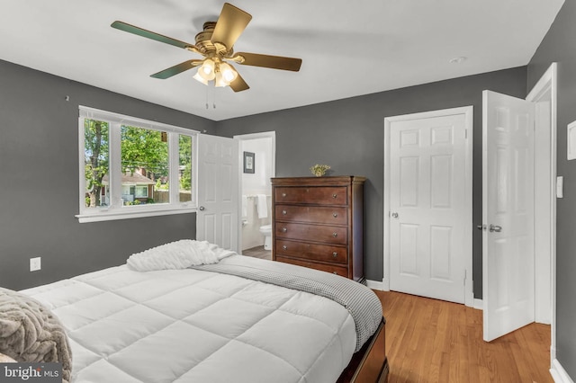 2300 Foster Pl, Temple Hills, MD 20748 - bedroom with light wood finished floors, baseboards, a ceiling fan, and ensuite bathroom