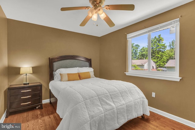 2300 Foster Pl, Temple Hills, MD 20748 - bedroom featuring baseboards, wood finished floors, and ceiling fan