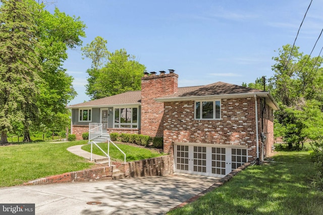 2300 Foster Pl, Temple Hills, MD 20748 - view of front of house with a chimney, brick siding, and a front lawn