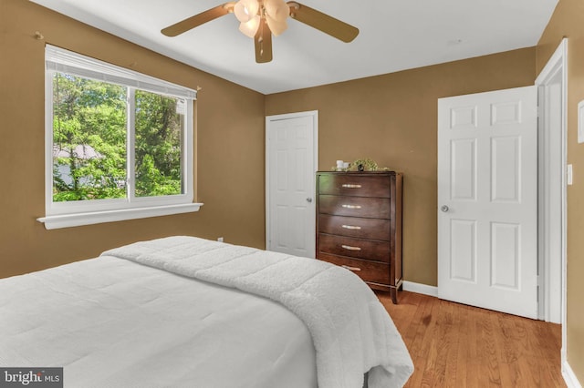 2300 Foster Pl, Temple Hills, MD 20748 - bedroom with light wood-type flooring, baseboards, and a ceiling fan