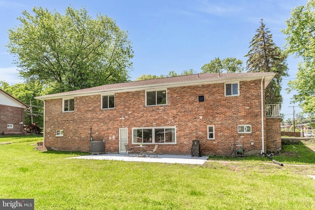2300 Foster Pl, Temple Hills, MD 20748 - rear view of house featuring a yard, a patio area, central air condition unit, and brick siding