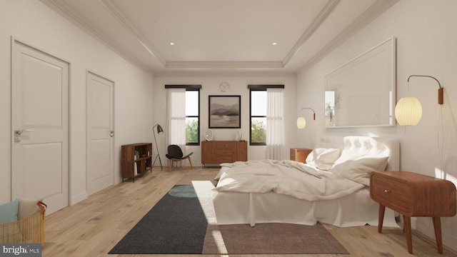 bedroom with a raised ceiling, wood finished floors, and ornamental molding