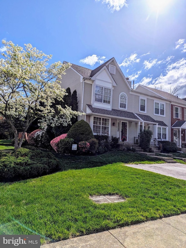 view of front of property with a front lawn