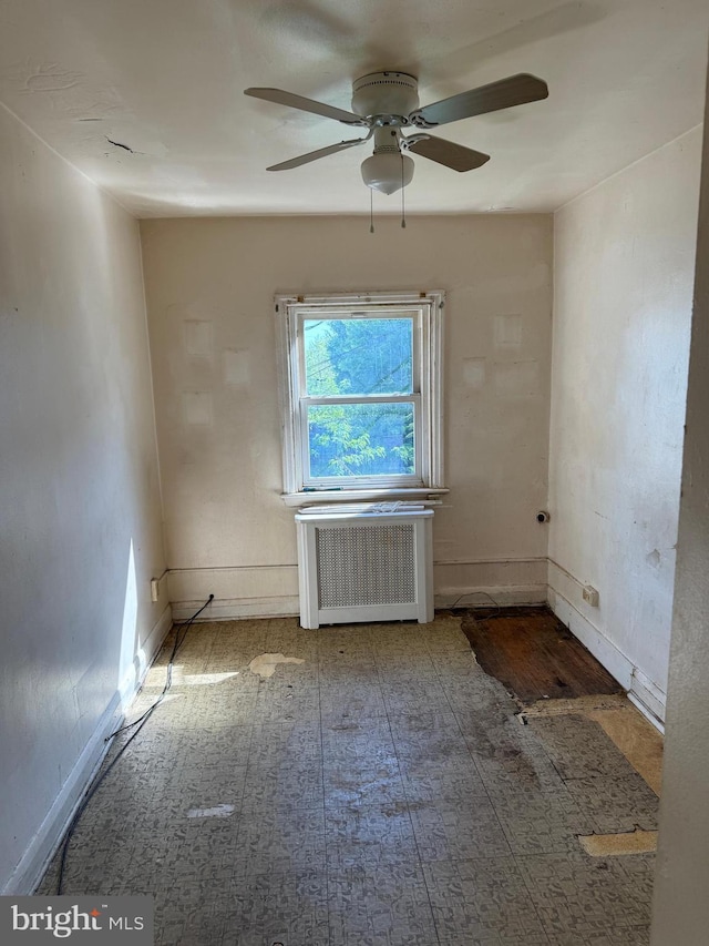 4333 Pimlico Rd, Baltimore, MD 21215 - empty room with radiator heating unit, baseboards, and a ceiling fan