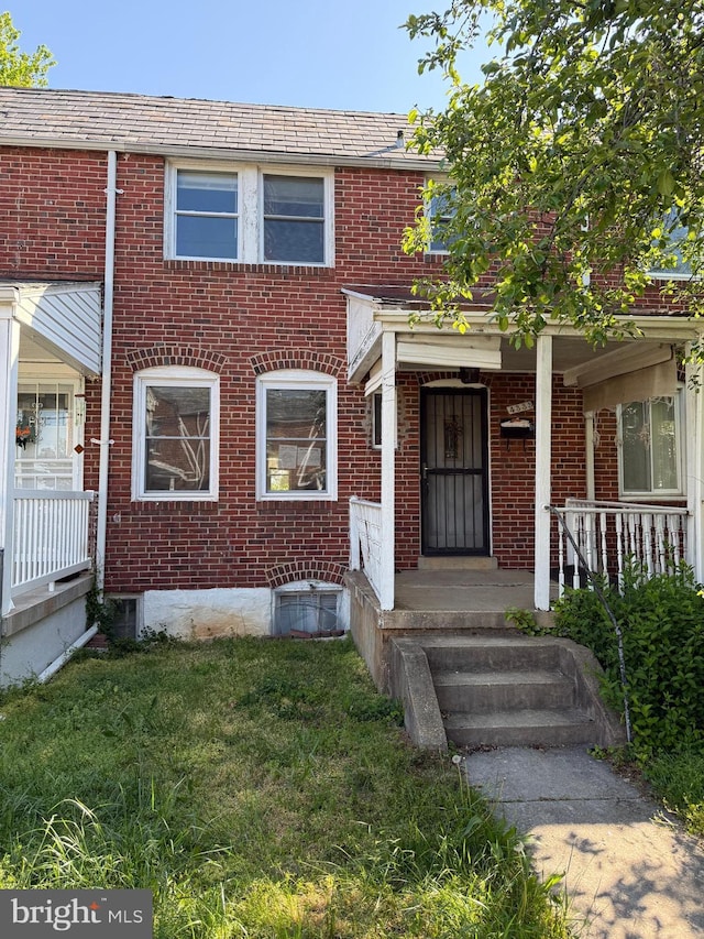 4333 Pimlico Rd, Baltimore, MD 21215 - townhome / multi-family property featuring brick siding and a front yard