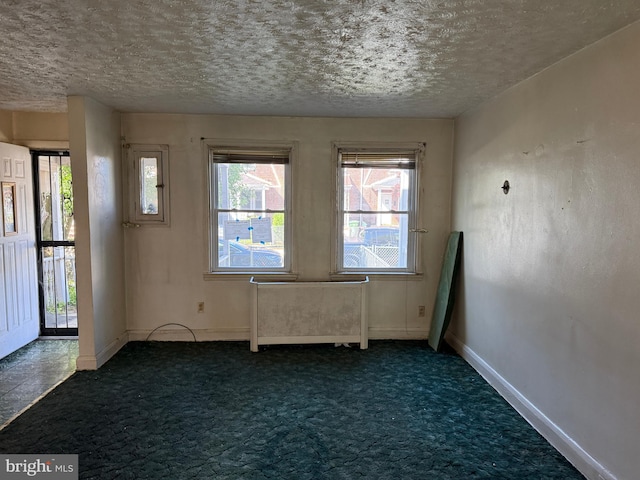 4333 Pimlico Rd, Baltimore, MD 21215 - carpeted spare room featuring baseboards and a textured ceiling
