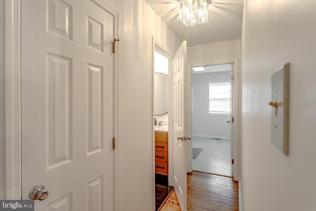 7 Teak Ct, Cherry Hill, NJ 08003 - hall with a sink, wood finished floors, and baseboards