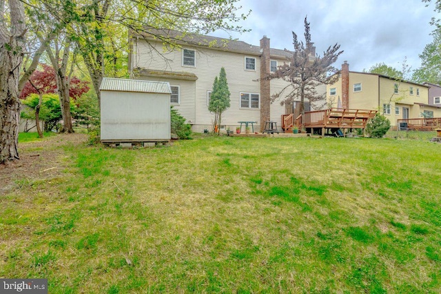 7 Teak Ct, Cherry Hill, NJ 08003 - rear view of house featuring a wooden deck, an outbuilding, a yard, a chimney, and a storage unit