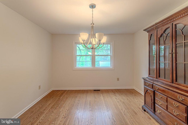 7 Teak Ct, Cherry Hill, NJ 08003 - empty room featuring visible vents, light wood-type flooring, a notable chandelier, and baseboards