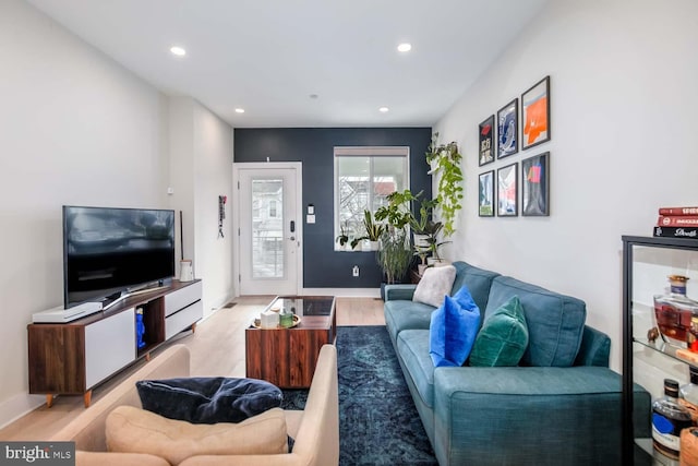 living room featuring recessed lighting and wood finished floors