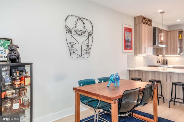 dining room featuring recessed lighting