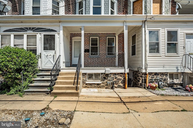 19 W 29th St, Wilmington, DE 19802 - property entrance featuring a porch and brick siding