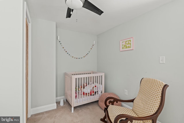 carpeted bedroom featuring ceiling fan and baseboards