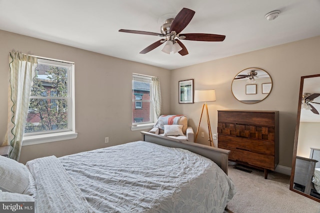 carpeted bedroom with a ceiling fan