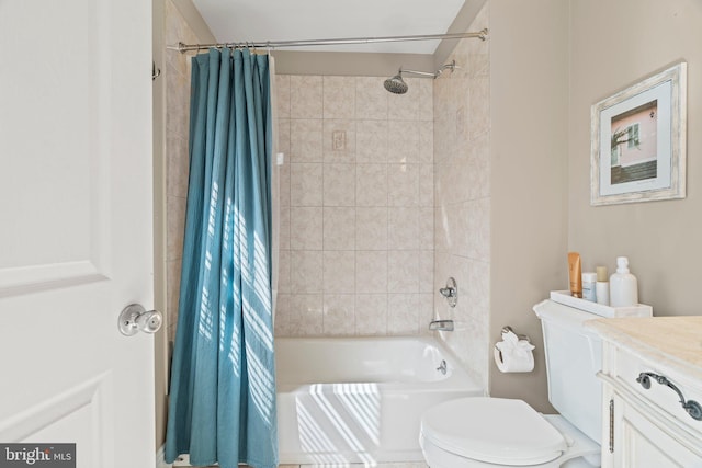 bathroom featuring shower / tub combo, toilet, and vanity