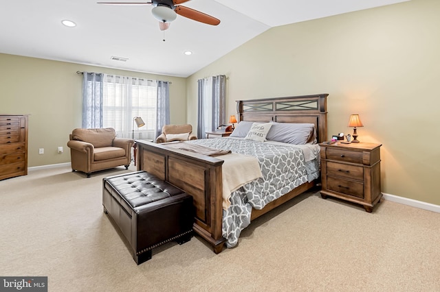 bedroom with light colored carpet, visible vents, lofted ceiling, and baseboards