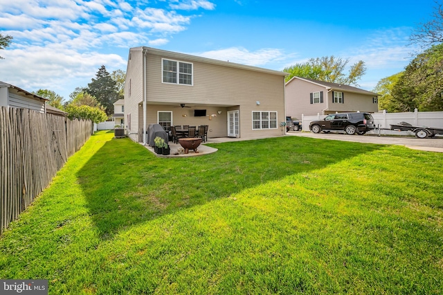 back of house featuring a lawn, cooling unit, a patio area, and fence private yard