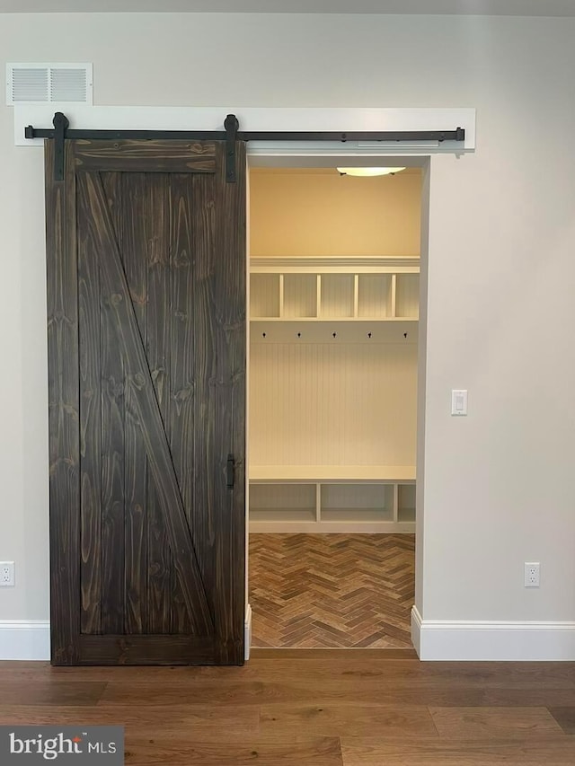 937 Swinehart, Boyertown, PA 19512 - mudroom featuring parquet floors, visible vents, a barn door, and baseboards