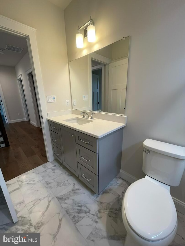 937 Swinehart, Boyertown, PA 19512 - bathroom with visible vents, baseboards, toilet, vanity, and marble finish floor