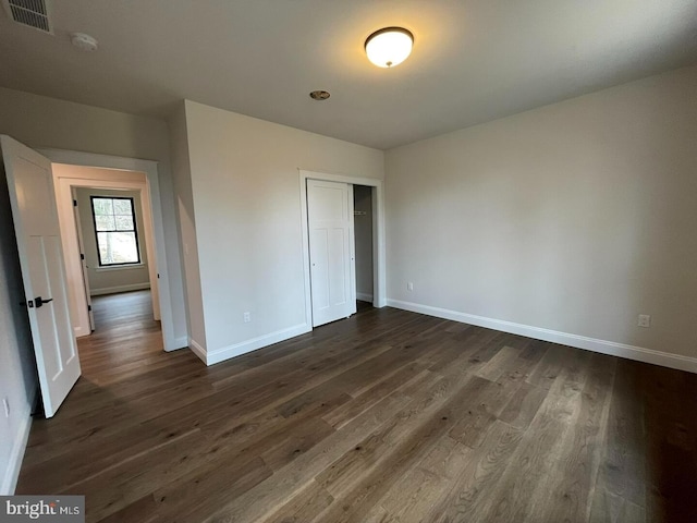 937 Swinehart, Boyertown, PA 19512 - unfurnished bedroom featuring baseboards, visible vents, and dark wood-type flooring