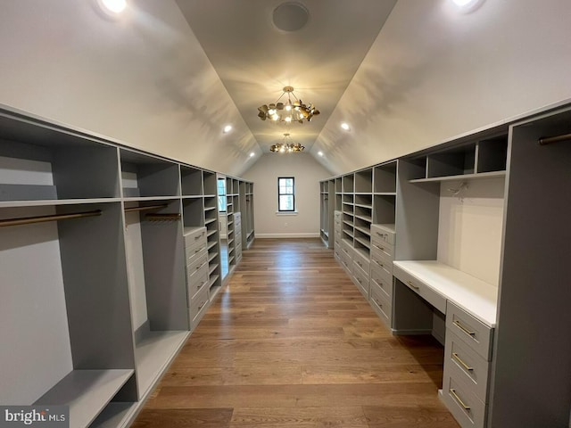 937 Swinehart, Boyertown, PA 19512 - walk in closet with a notable chandelier, wood finished floors, and lofted ceiling