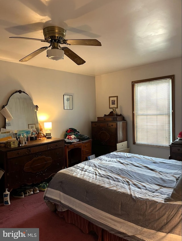 carpeted bedroom featuring a ceiling fan